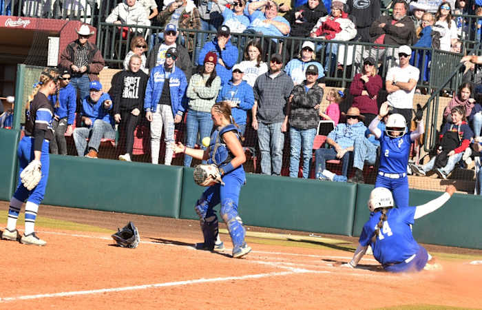 Piedmont's Taybor Moss (14) slides home with the winning run as the Wildcats came from behind in the bottom of the seventh to claim the Class 5A state fast pitch championship.